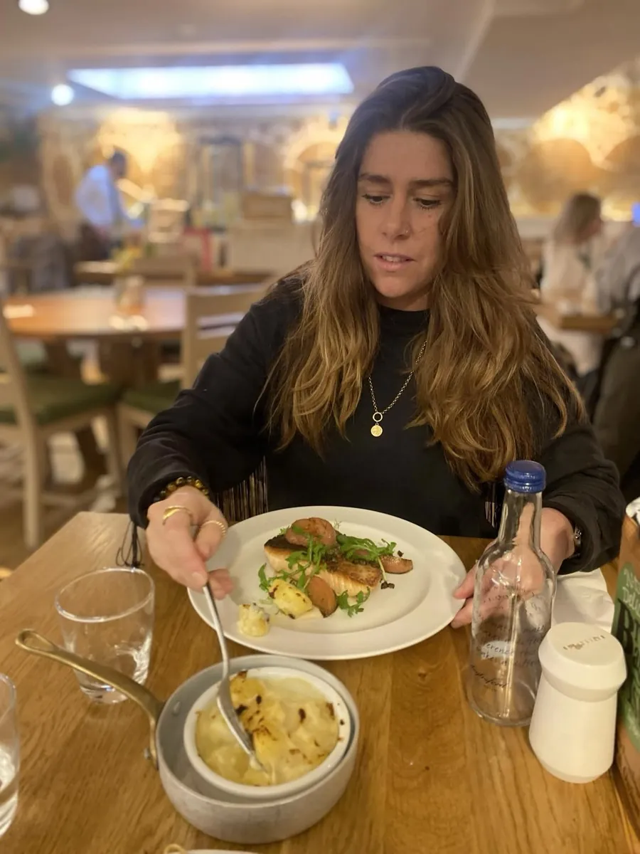 Louise eating a healthy, balanced meal out